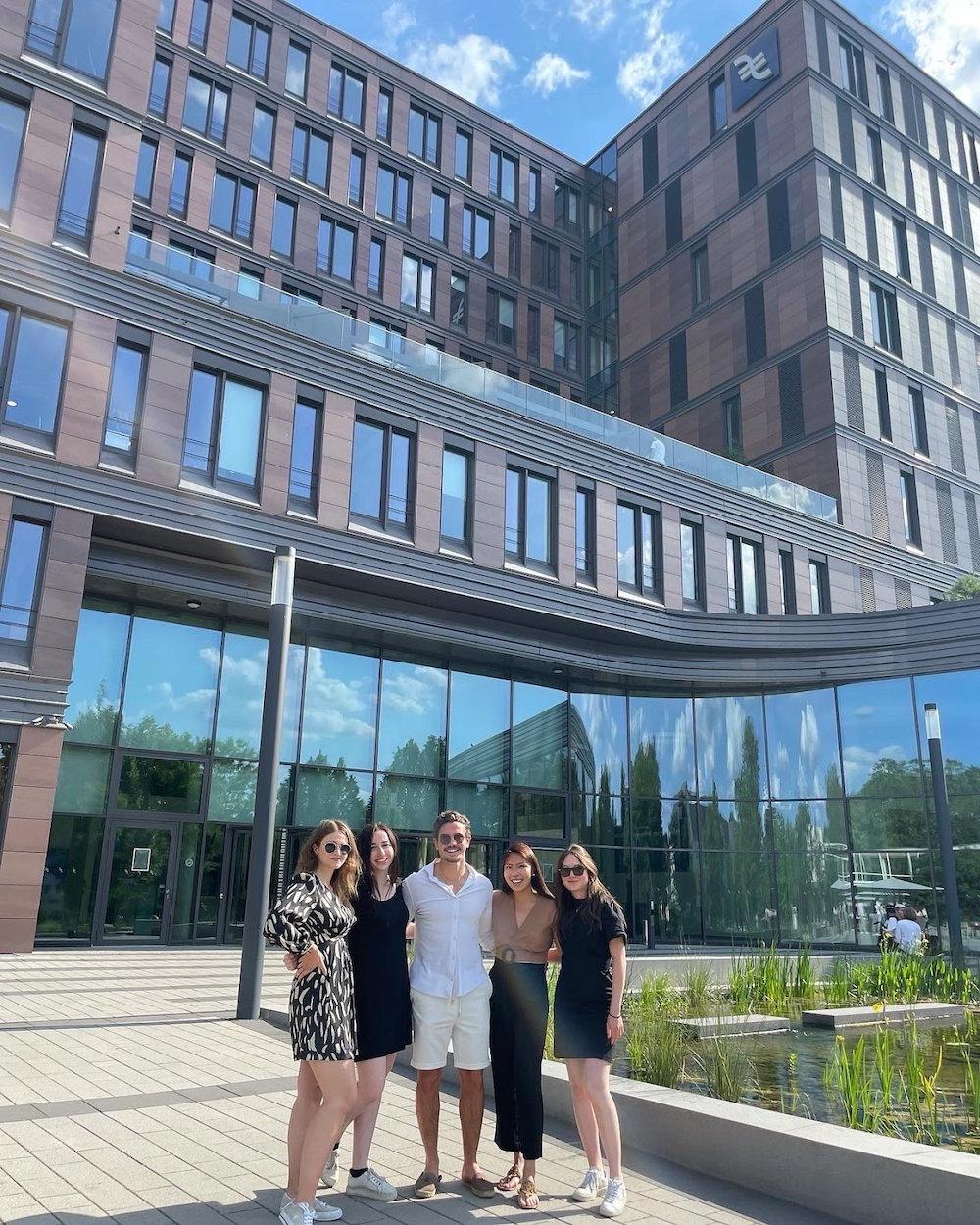 students in front of an office building