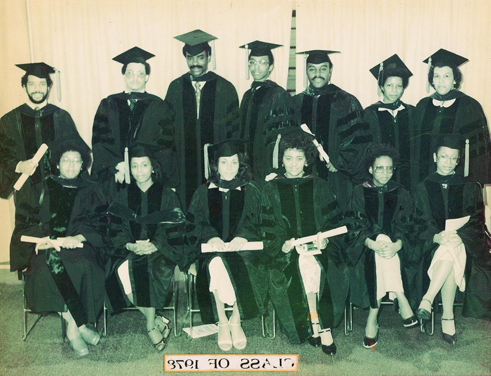 13 Black students posed together for a graduation photo with a caption reading Class of 1978