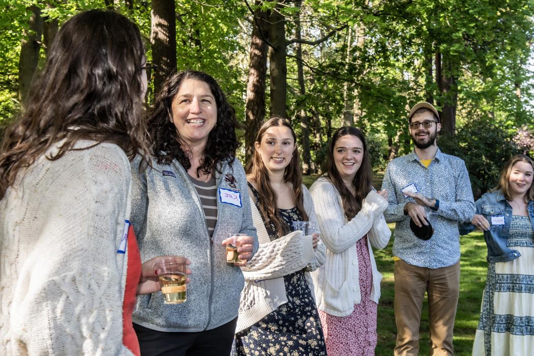 Coverage of VSLC reception at Hovey House before heading off to their volunteer sites over the summer.
Kate Daly talking with one of the volunteers at the reception.