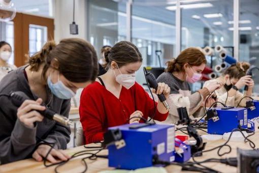 Students working in a maker lab.